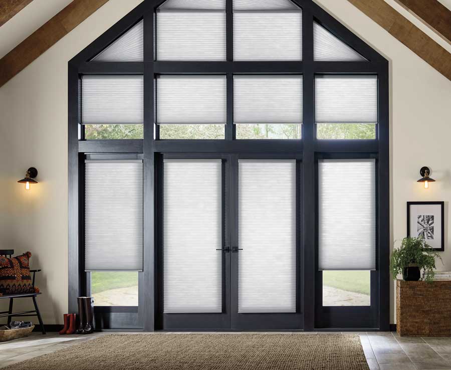 light gray honeycomb entryway shades on tall angled windows in Winnetka IL home