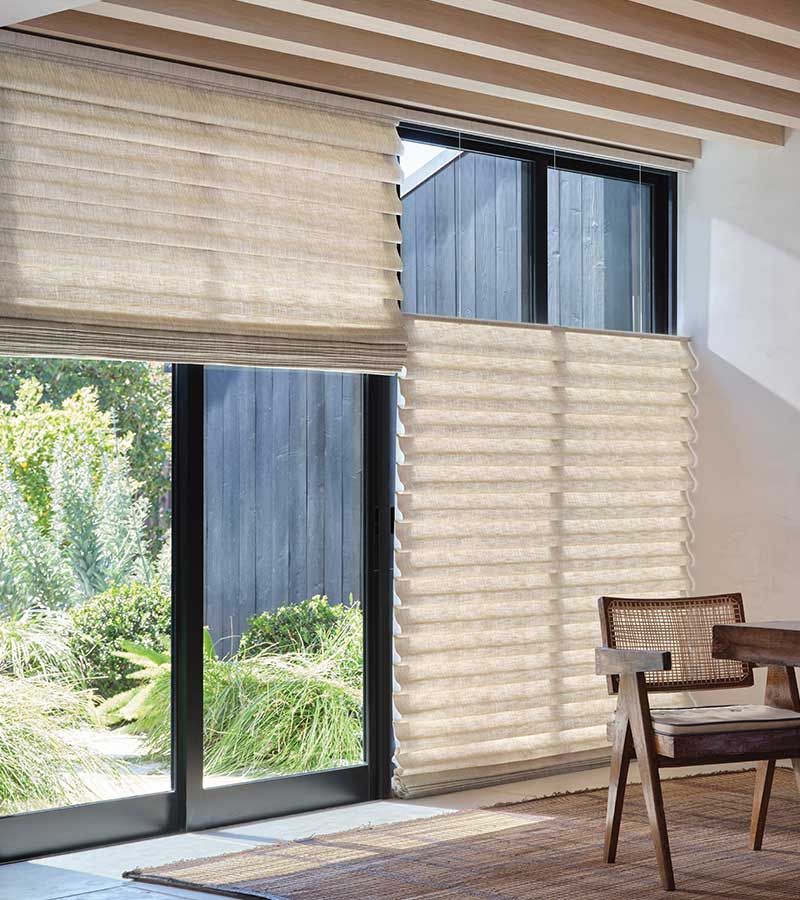 top down bottom up large window shadings with black trim windows overlooking lush outdoor yard