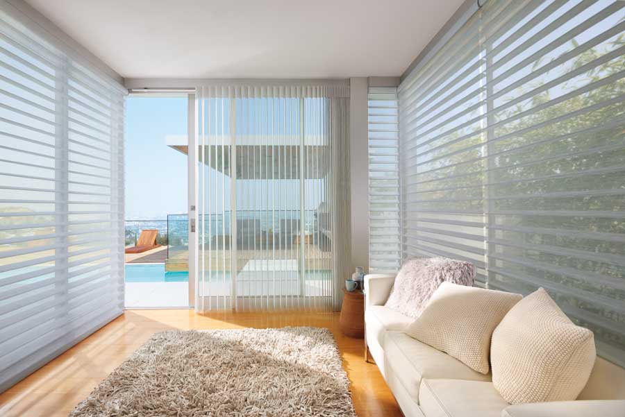 all glass room with sheer shades to soften light and show off view