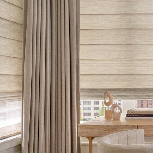 custom drapery layered with alustra woven textures roman shades