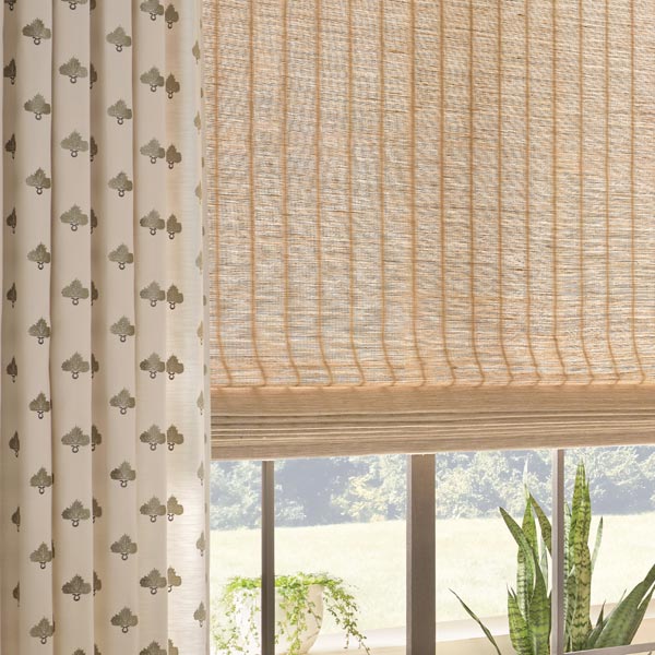 provenance woven wood shades with custom embroidered drapery