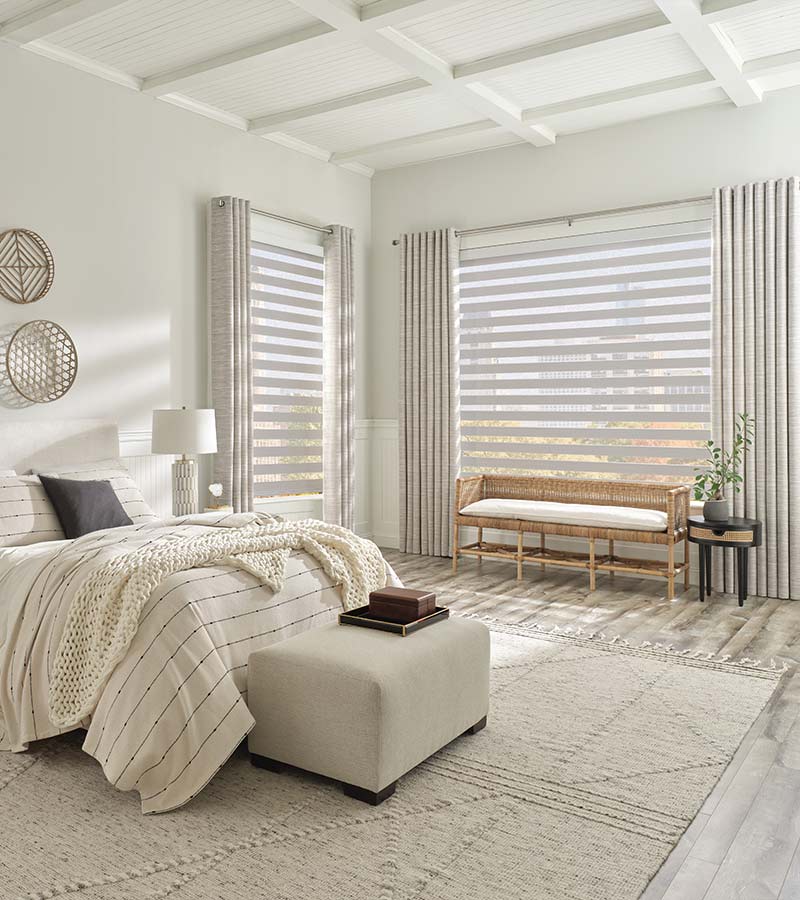 White Bedroom with Roller Zebra Shades on Windows with Side Drapes