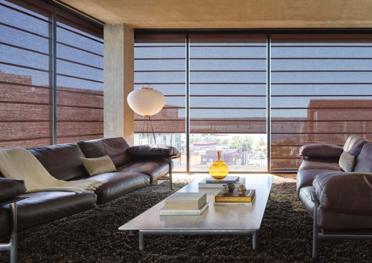 modern industrial loft with dark architectural roller shades