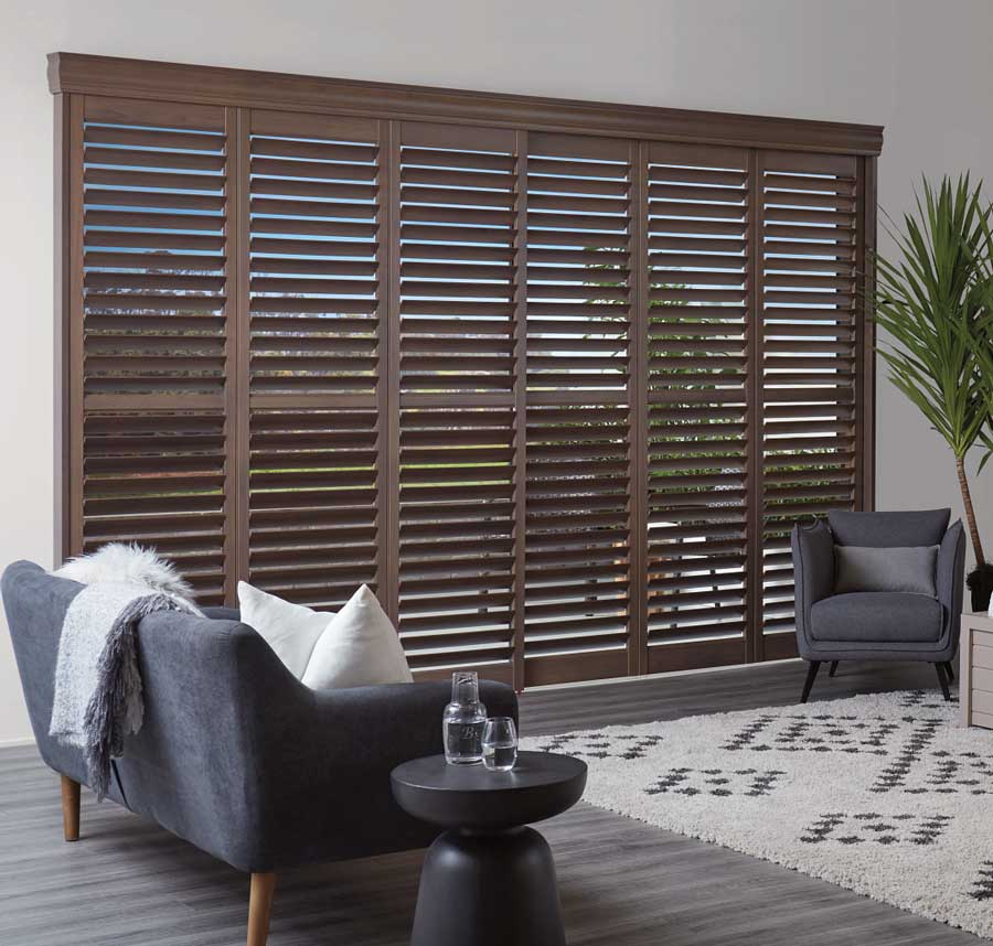 wood grain newstyle shutters that open with bypass track on sliding door
