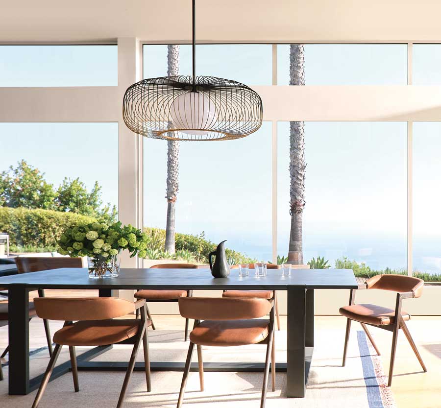 dining room with tall windows letting in too much light and UV rays