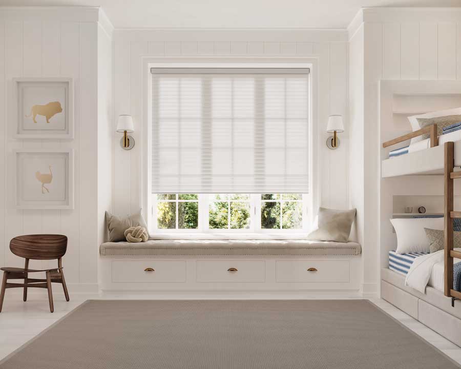guest room with bunk beds and cellular roller shades on windows
