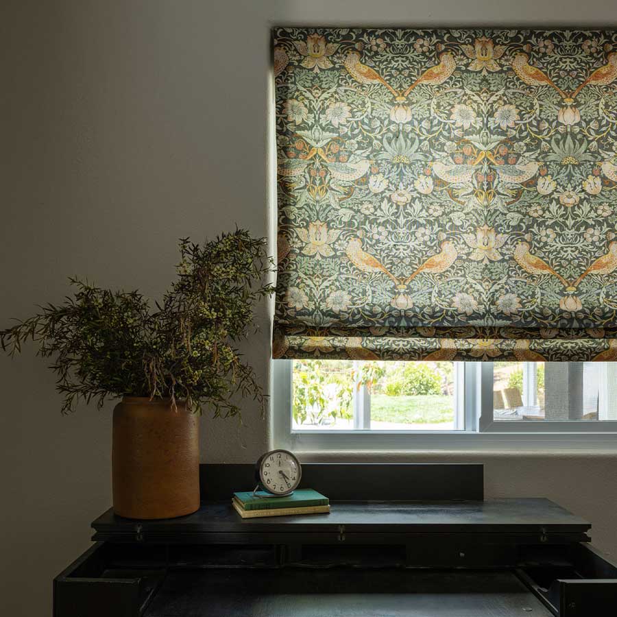 green roman shades with trending fabric patterns in birds and botanical prints
