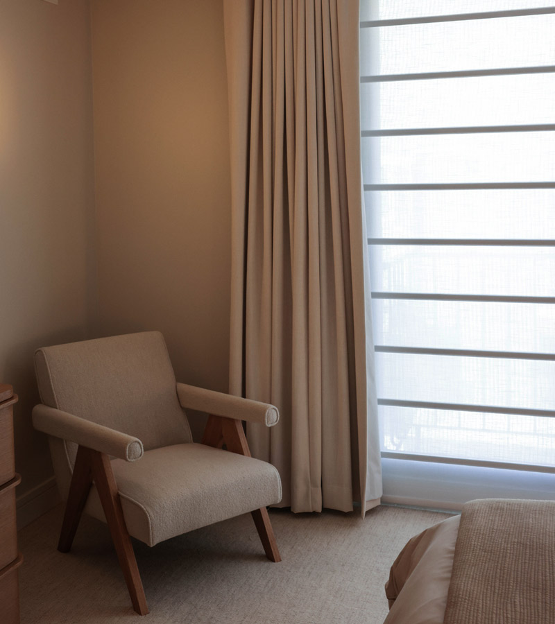 drapery in bedroom with black out drapery with chair