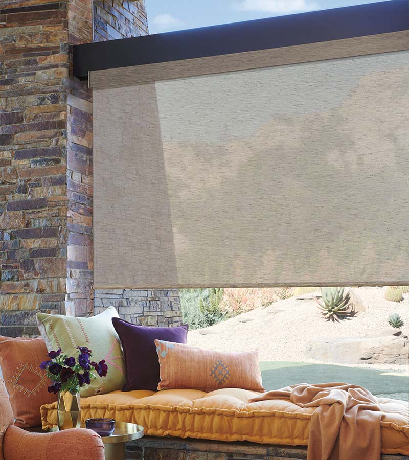 brown designer roller shades next to window seat skyline window coverings chicago