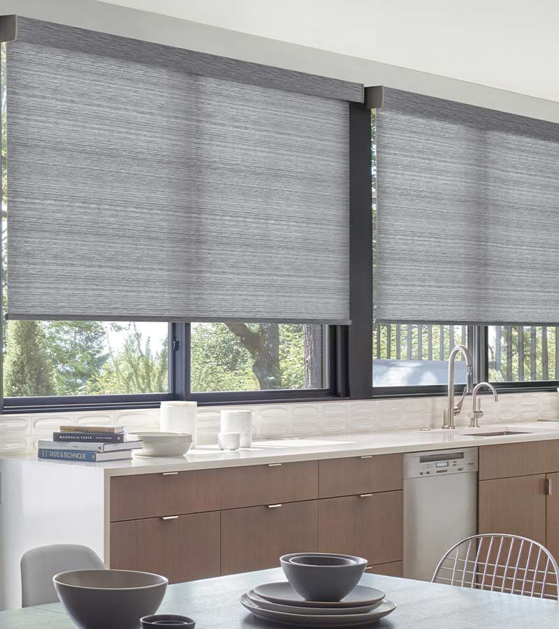 blue gray designer roller shades in kitchen