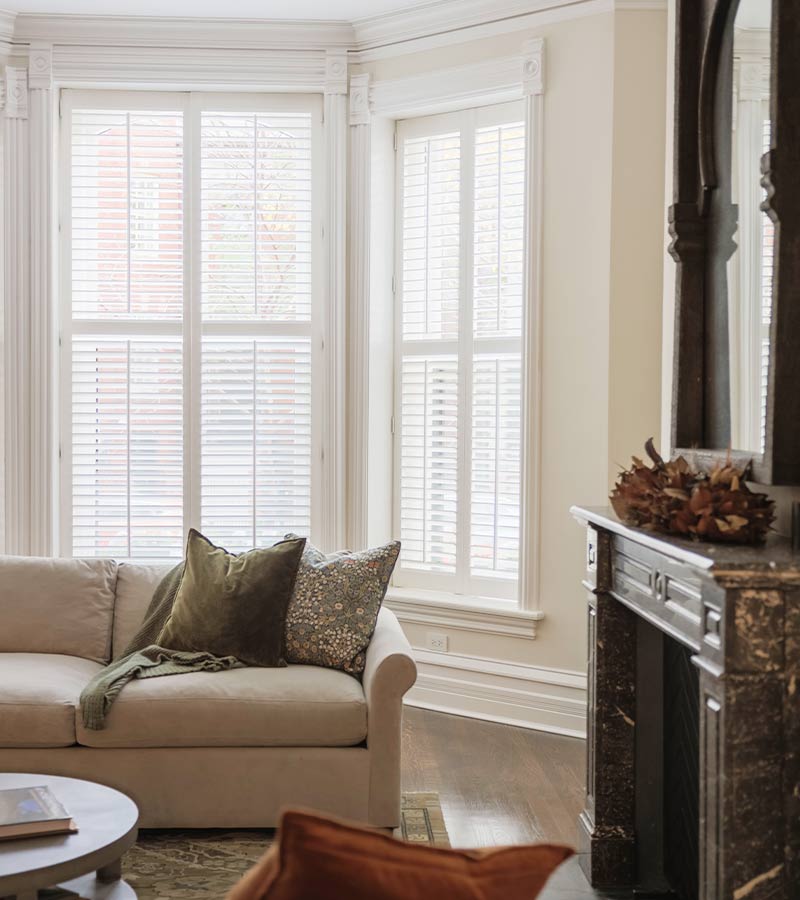 White shutters installed on windows in White Plains