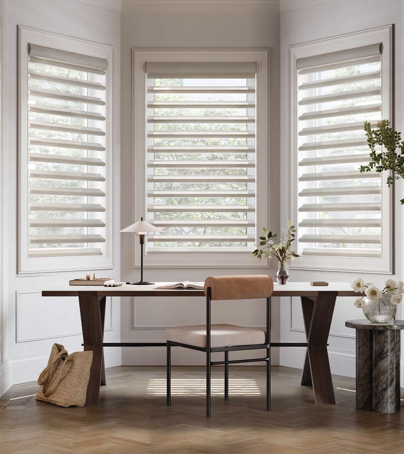 skyline-window-coverings-white-plains-new-york-pirouette-window-shadings-for-home-office Pirouette shades on bay window area of home office in white plains for glare control