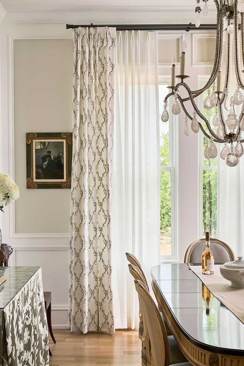 french country dining room with euro pleat drapery layered with sheer drapery panels for dual light control