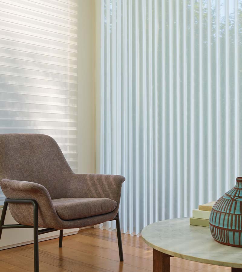 luminette-vertical-sheer-shades-hunter-douglas-skyline-window-coverings living room with white sheer vertical window shade