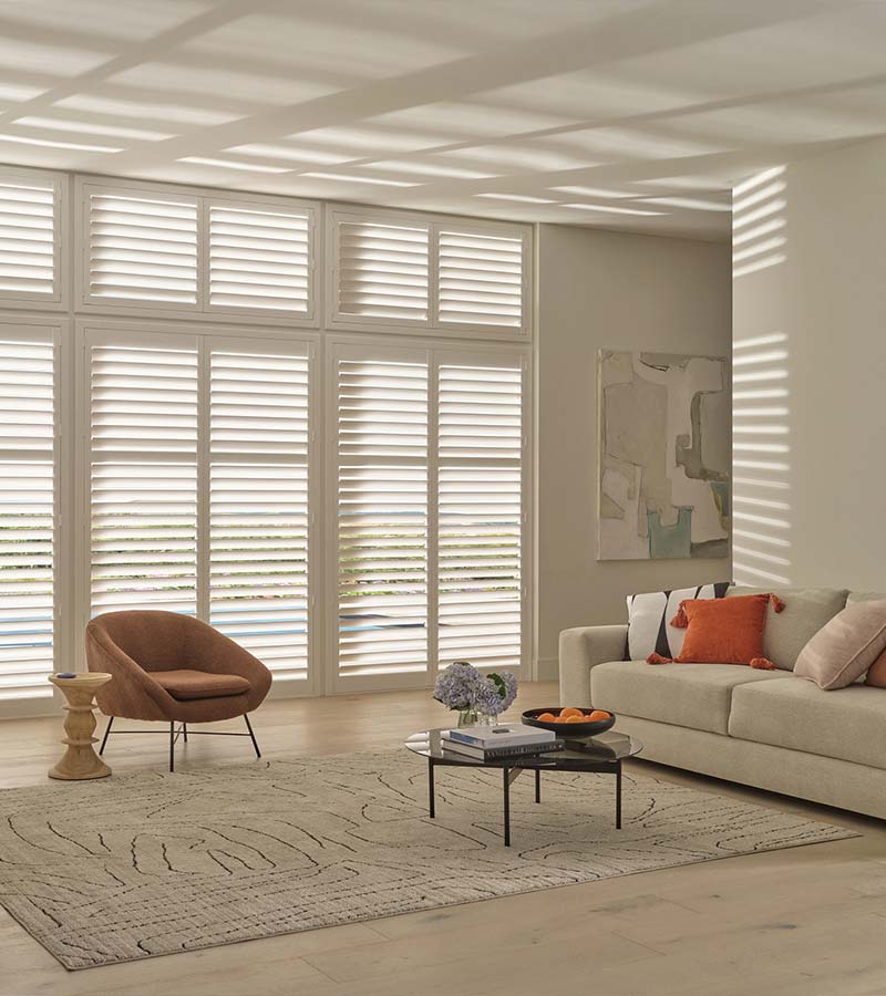 Palm Beach™ PolySatin™ vinyl shutters in a bright living room