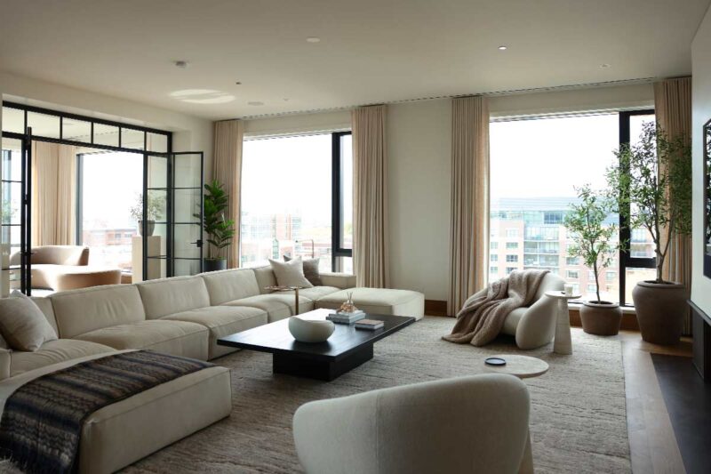 custom window treatments for living room condo with floor to ceiling windows