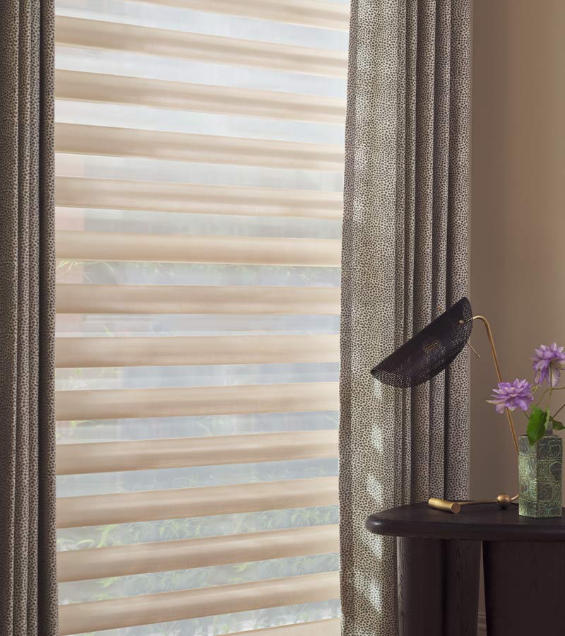 pirouette-window-treatments-layered-drapery-side-panel-details-hunter-douglas-skyline-window-coverings adjustable fabric vanes on Pirouette shades controlling glare