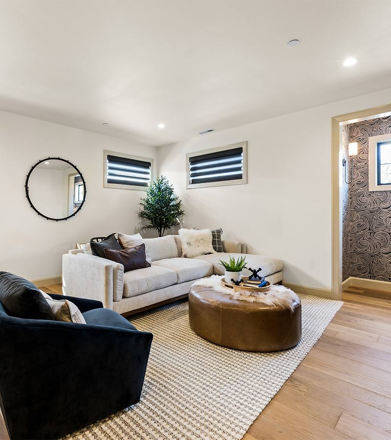 affinity-homes-design-portland-hunter-douglas-basement-window-shades-skyline-window-coverings Portland basement with dark Pirouette shades for room darkening control