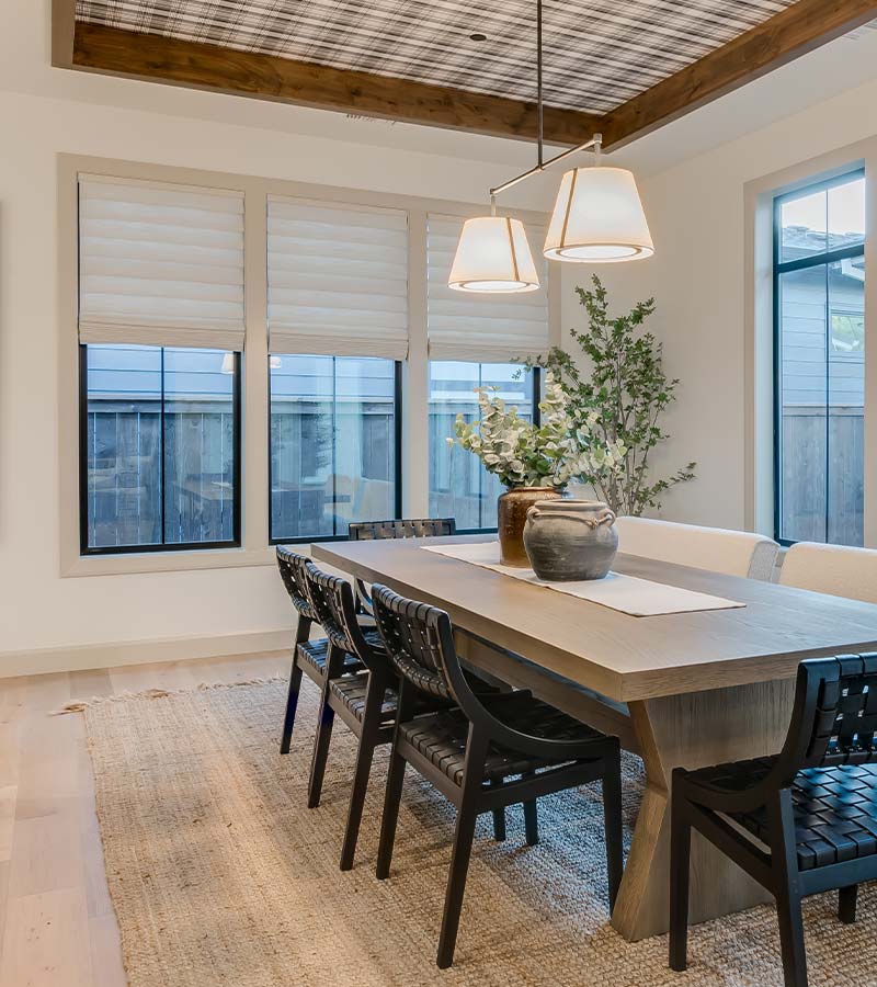 affinity-homes-design-portland-hunter-douglas-roman-shades-skyline-window-coverings Portland vignette modern roman shades on multiple windows in dining room for adjustable light control