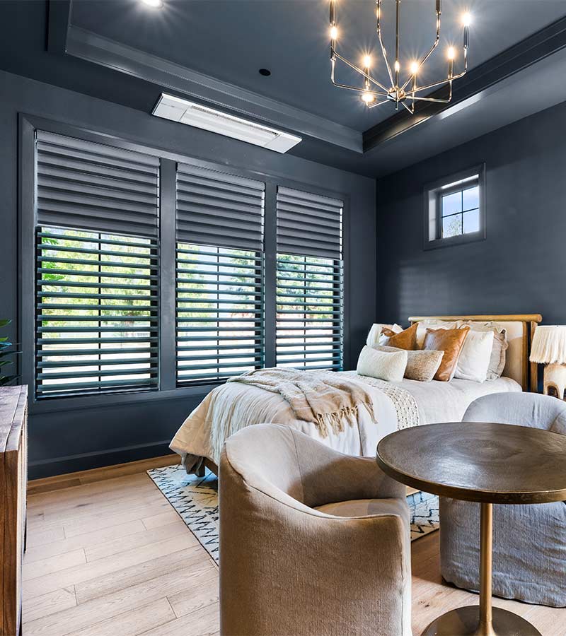 affinity-homes-design-portland-primary-bedroom-hunter-douglas-window-shades-skyline-window-coverings Primary bedroom with smoky blue Pirouette shades and dual shades for room darkening