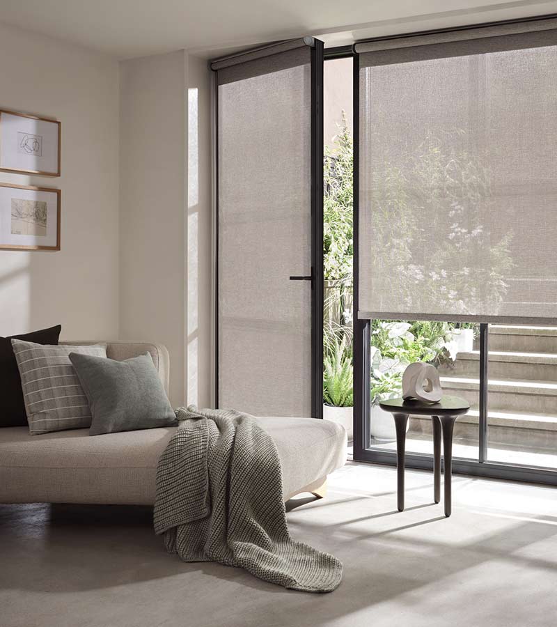 grey designer screen shades for glass door in entryway with handle