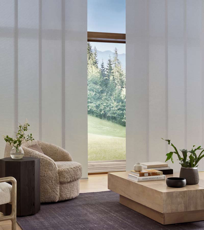 beautiful skyline gliding window panels by hunter douglas for relaxing living room with moutain views