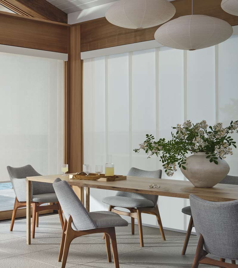 skyline gliding window panels for large windows in serene dining room