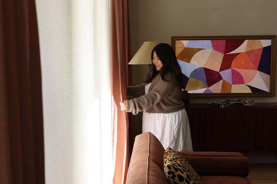 coordinating roller shades and custom drapery throughout open-concept Chicago condo